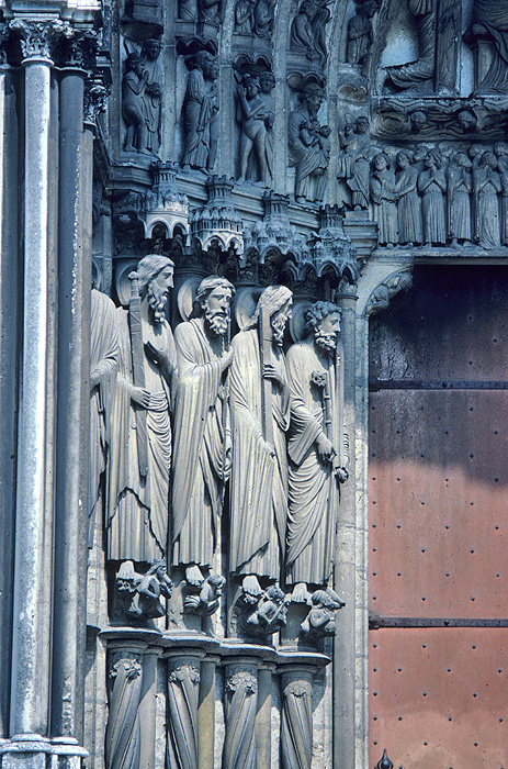 Exterior, central bay, left jamb figures