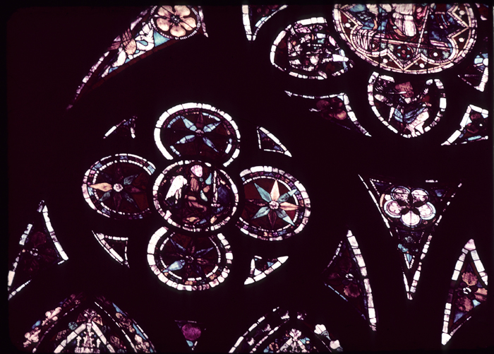 Nave, north, top, window 3, left rose