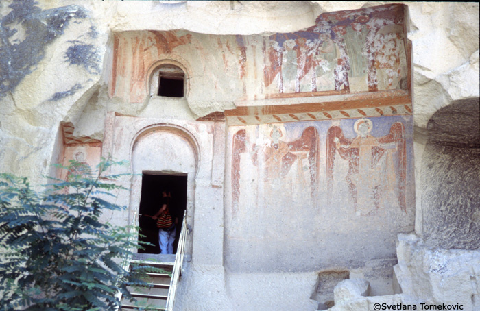 Exterior, west, fresco showing angel