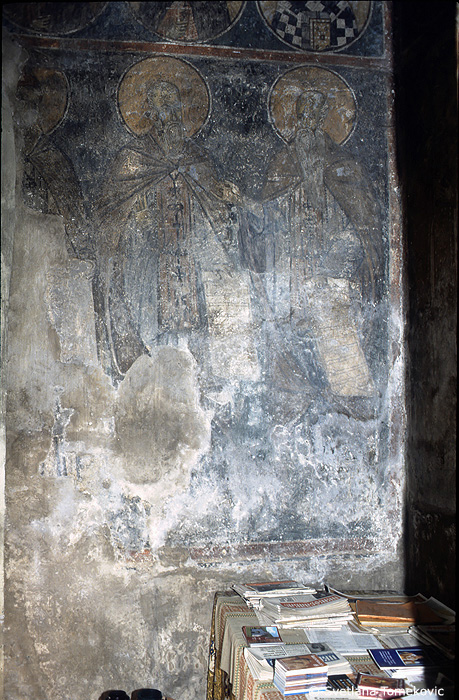 Fresco, to the right of the door