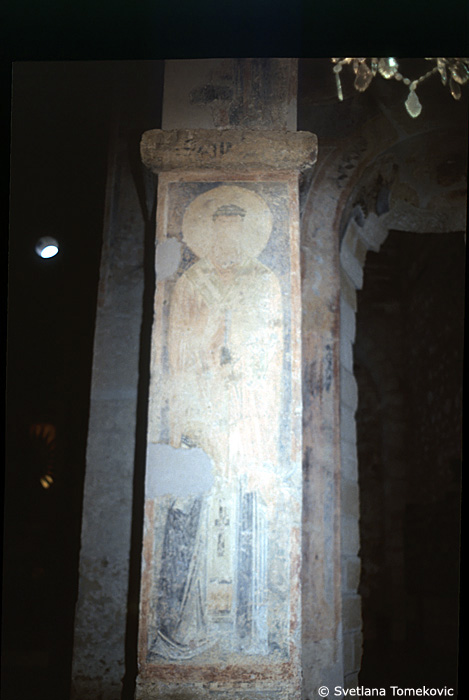 Fresco, first arch, south, east face, showing Saint?