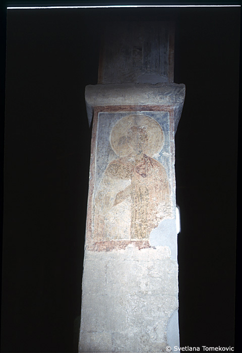 Fresco, south aisle, second arch, west face, showing Saint?