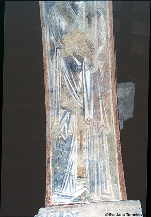 Fresco, south aisle, top of third arch, east face showing Saint?