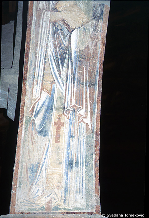 Fresco, south aisle, third arch, west face, showing Saint?