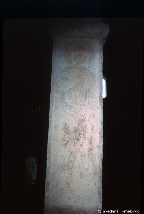 Fresco, south aisle, third arch, west face, showing Saint?