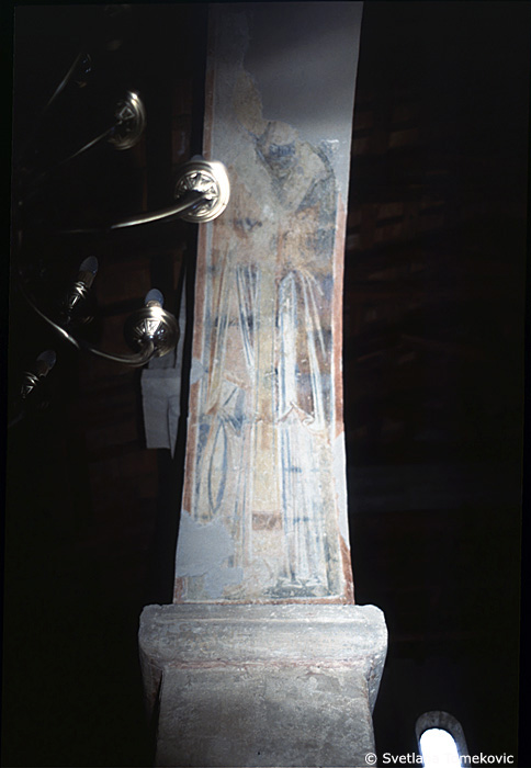Fresco, south aisle, fourth arch, west intrados, showing Saint?
