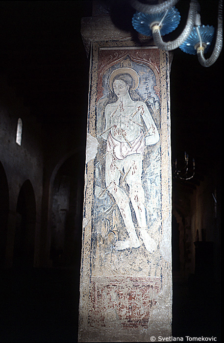 Fresco, south aisle, fifth arch, east face, showing Saint?