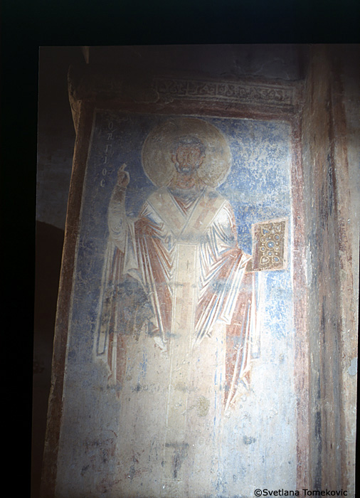 Fresco, south aisle, north wall, first register, east end, showing Saint?