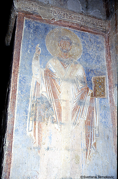 Fresco, south aisle, north wall, first register, east end, showing Saint? (detail)