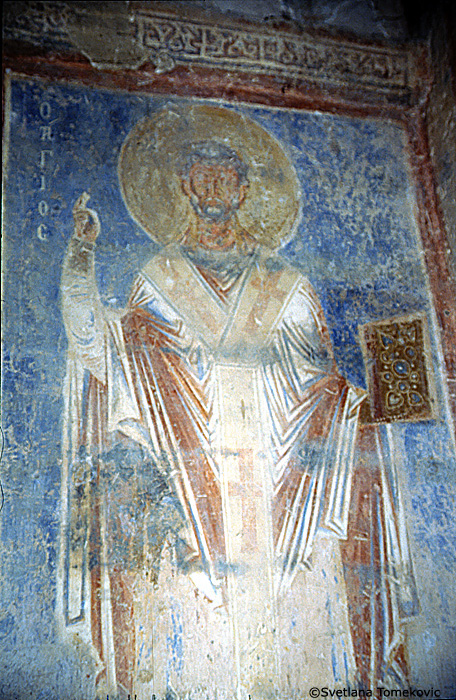 Fresco, south aisle, north wall, first register, east end, showing Saint? (detail)