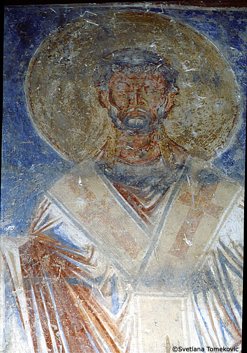 Fresco, south aisle, north wall, first register, east end, showing Saint? (detail)