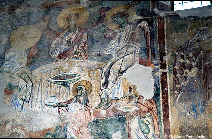 Fresco, central nave, south wall, showing Abraham: entertaining the Angels
