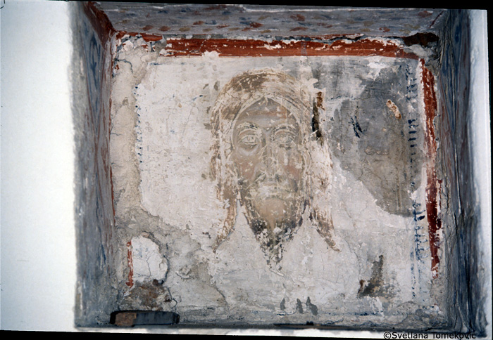 Fresco, west wall, niche, to the right  of the door showing face 
