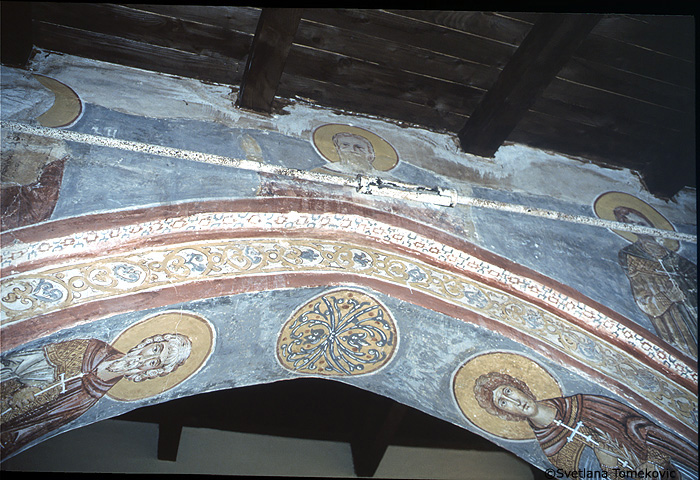 Fresco, nave, north aisle, above arch showing saints?