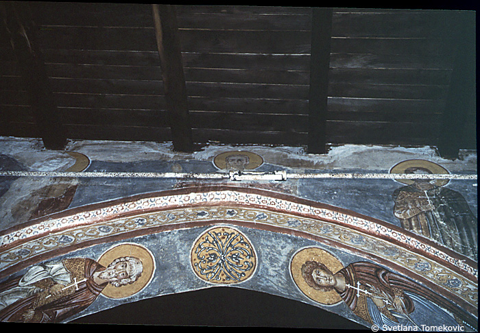 Fresco, nave, north aisle, south wall, above third arch, showing saints?