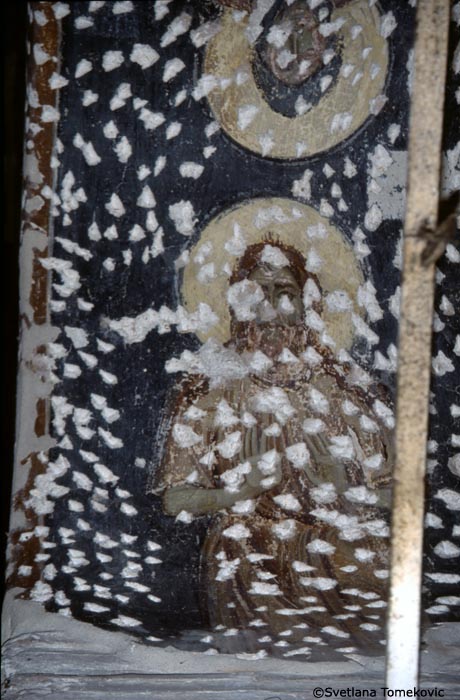 Fresco, arcade, intrados of arch showing monk