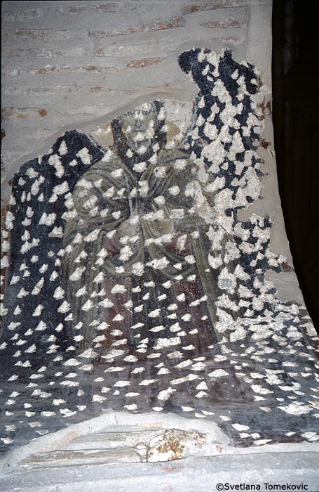 Fresco, arcade, intrados of arch showing monk