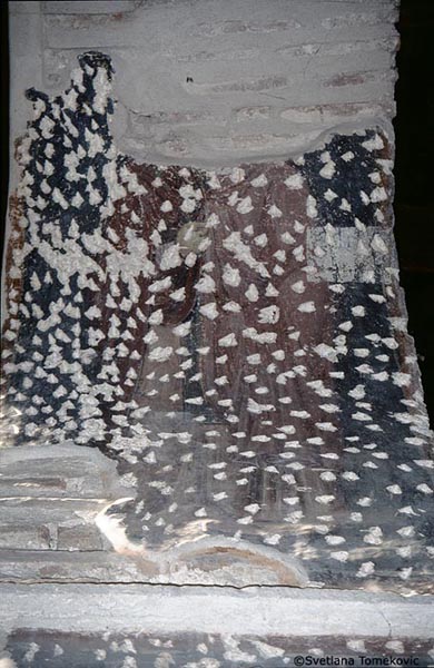 Fresco, arcade, intrados of arch showing monk