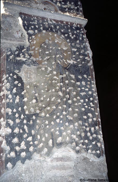 Fresco, arcade, intrados of arch showing monk