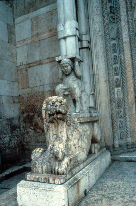 Exterior west, porch of central portal, supporting figure, lion, 1135-1150, Nicholaus