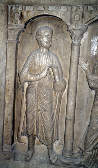 Sarcophagus, right end, man holding roll in left hand, right hand raised, late 4c.