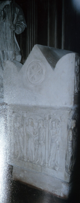 Sarcophagus cover showing chrismon, and left end of body showing  male figure, family group, Moses  receiving law, late 4c.