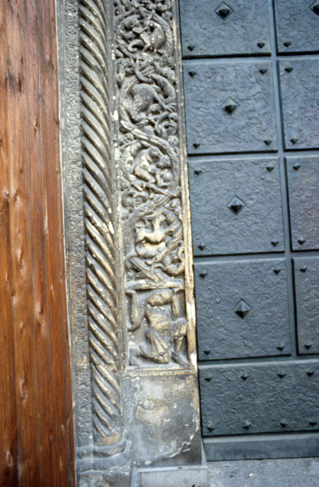 Exterior west, portal,  left jamb face, animals, supporting figure, early 12c., Wiligelmo