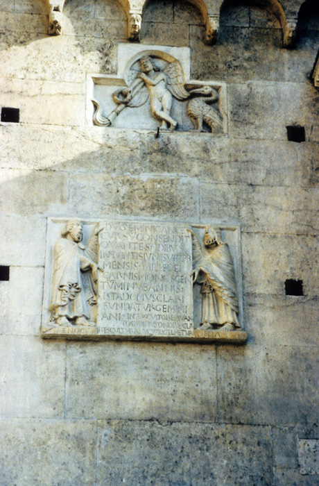 Exterior west, bay 3, relief 1, Genius with ibis, and relief 2, Enoch and Elijah holding plaque, early 12c.,  Wiligelmo