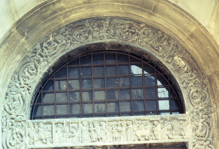 Exterior south, Porta dei Principi, scenes from life of Geminianus of Modena on lintel, early 12c., Lanfranco