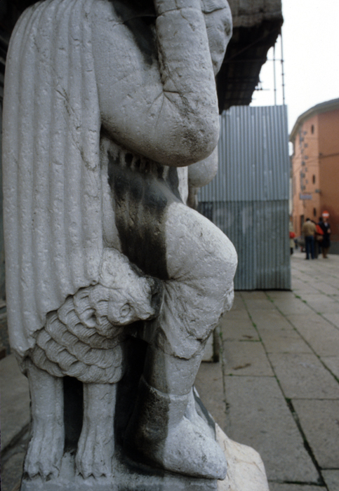 Exterior west, possibly left porch, left supporting figure, 1122-1130, attributed to Wiligelmo