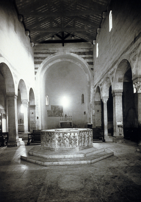 Interior view showing font, late 12c.-early 13c., attributed to either Brioloto or Benedetto Antelami