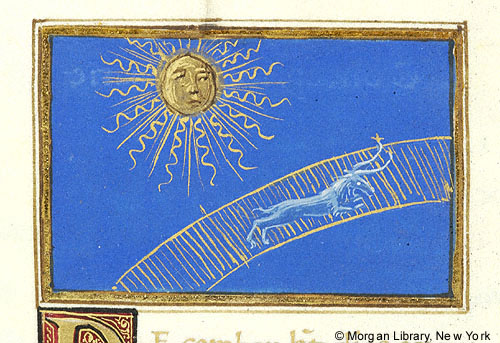 A detail of a manuscript page depicting the sun with a human face and wavy rays beside a goat on a golden arc, all against a blue ground